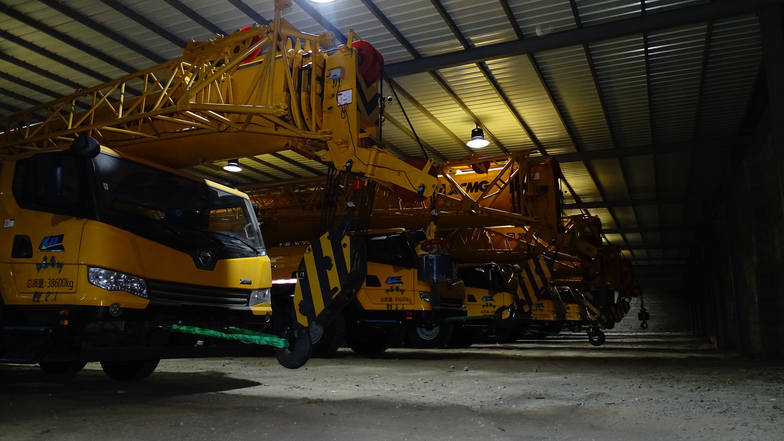 A diverse lineup of heavy construction equipment at a job site.