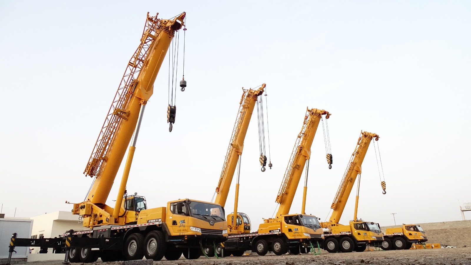 A fleet of heavy construction machinery lined up